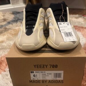 Brand New Yeezy Kids size 6.5 Sneakers in Cream and Black